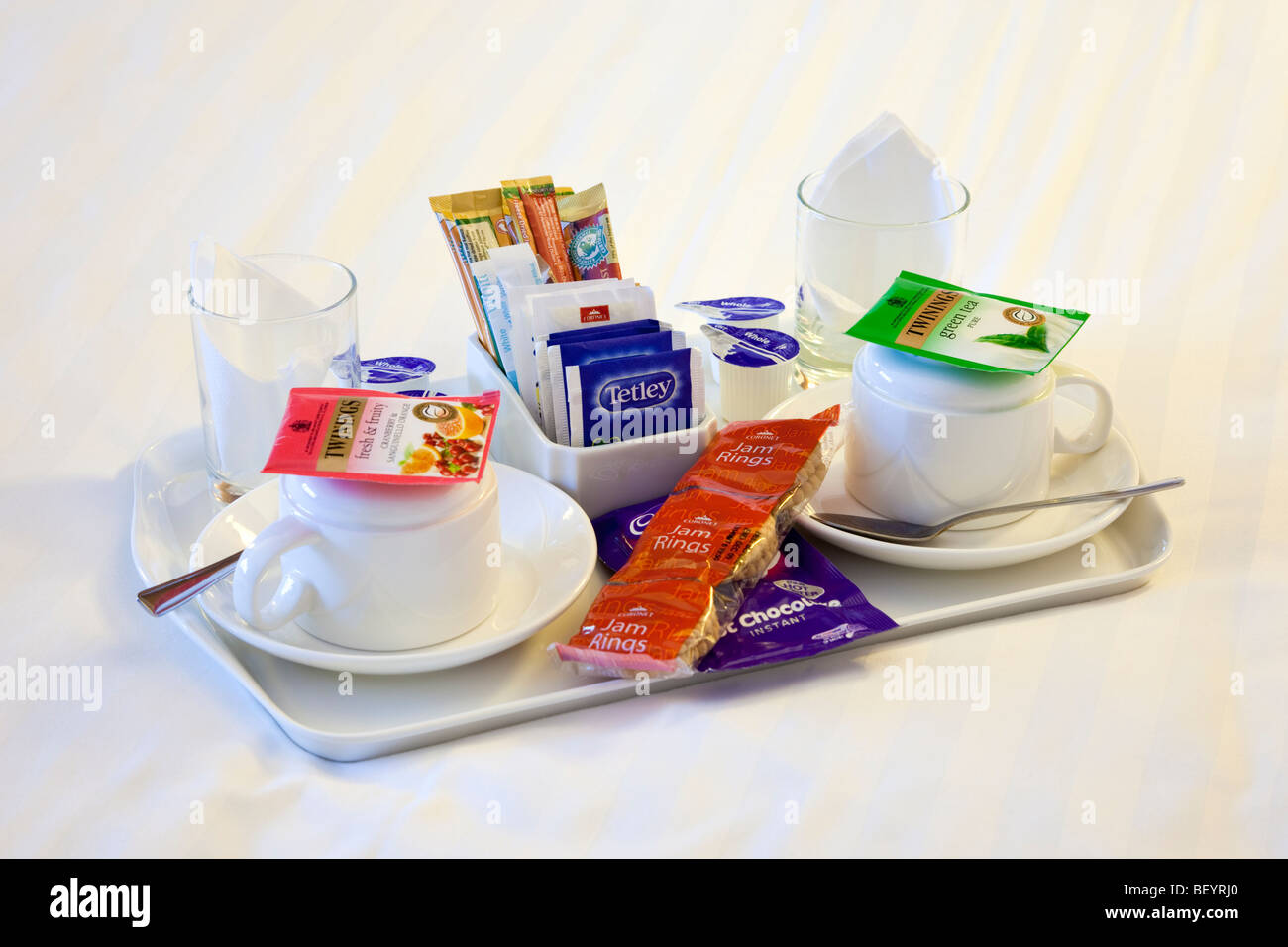 Tea and coffee tray on a hotel room bed Stock Photo