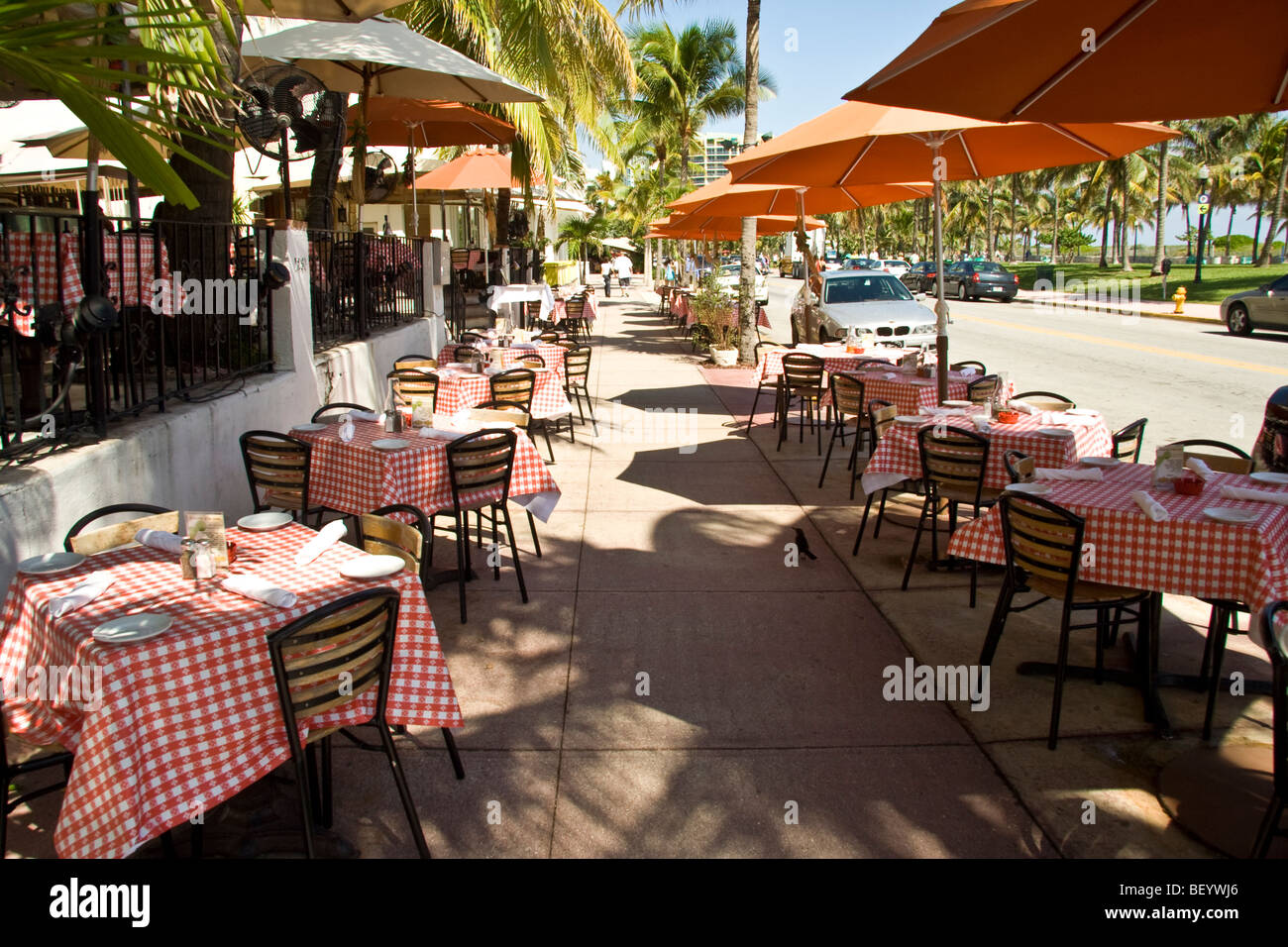 tables outside at a restaurant on ocean drive miami beach florida Stock