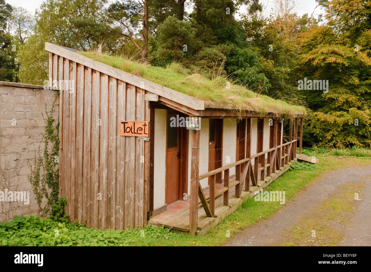 Outdoor toilet block with ecological grass roof. Stock Photo