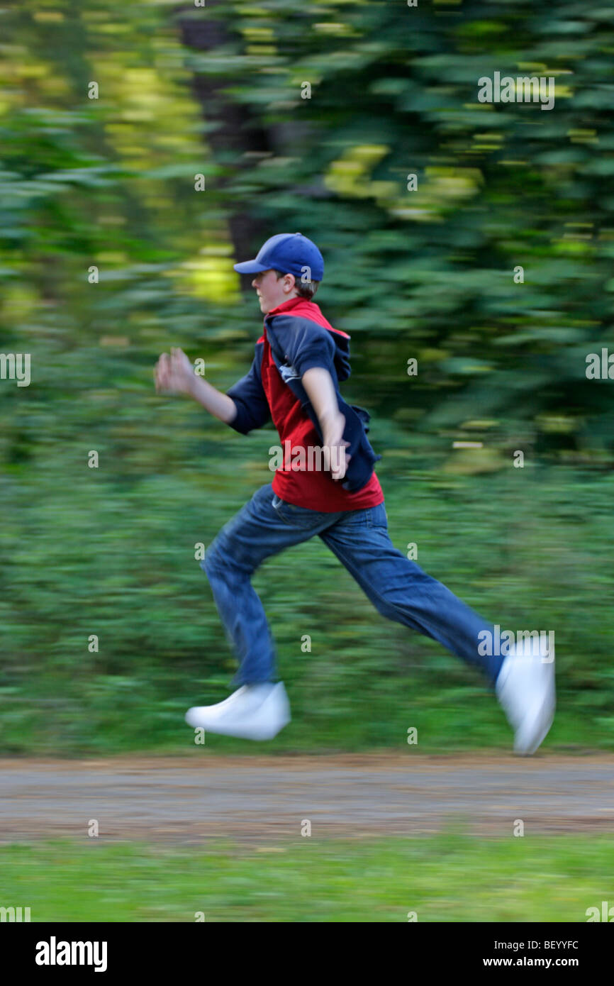 Teenage boy running forest hi-res stock photography and images - Alamy