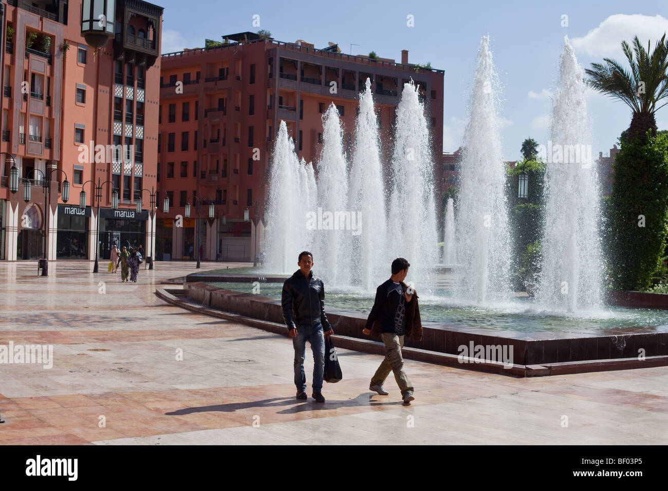 People on the main square of the modern Part of Marrakesh, Morocco called Ville Nouvelle. Stock Photo