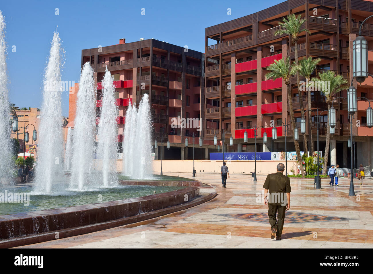 People on the main square of the modern Part of Marrakesh, Morocco called Ville Nouvelle. Stock Photo