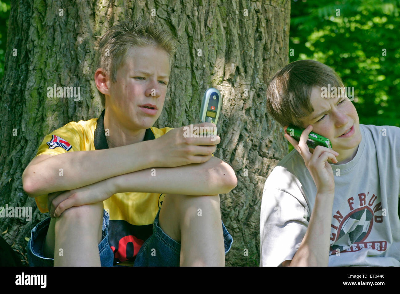 teenagers with their mobile phones Stock Photo