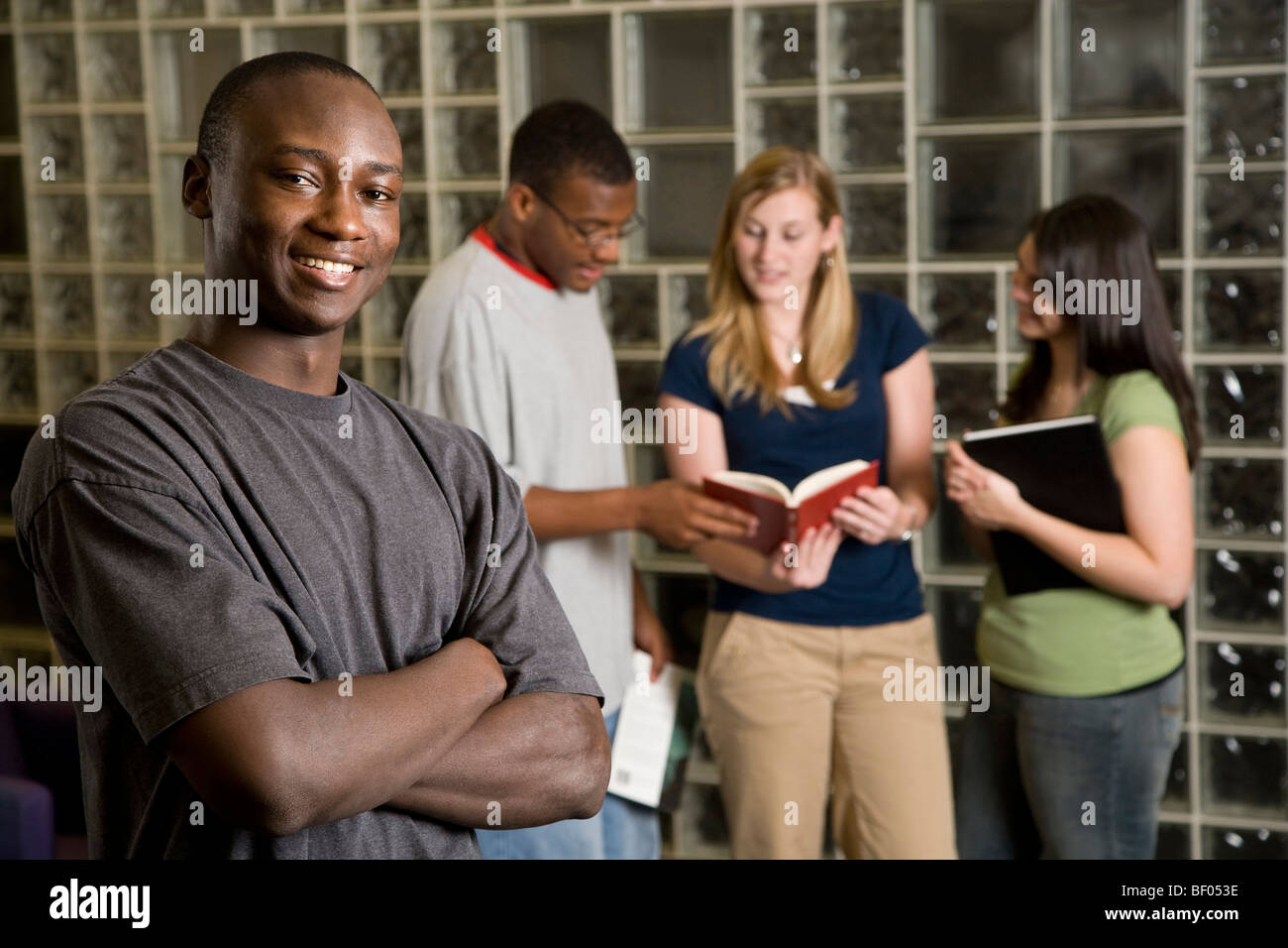 Group of young adults study together in a library Stock Photo - Alamy