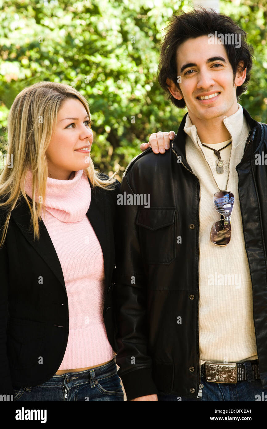 Couple smiling in a park Stock Photo - Alamy