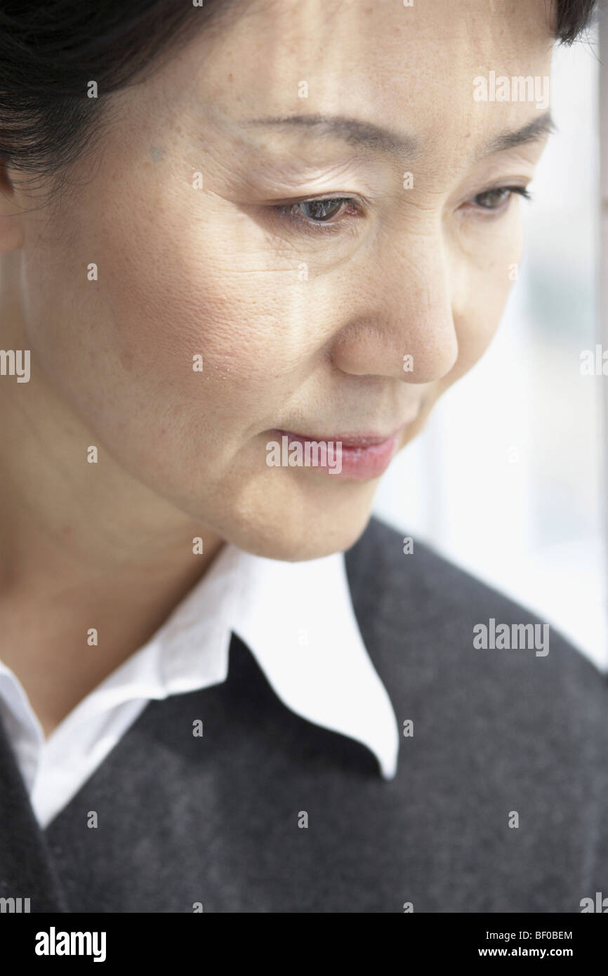 Woman close up looking down hi-res stock photography and images - Alamy