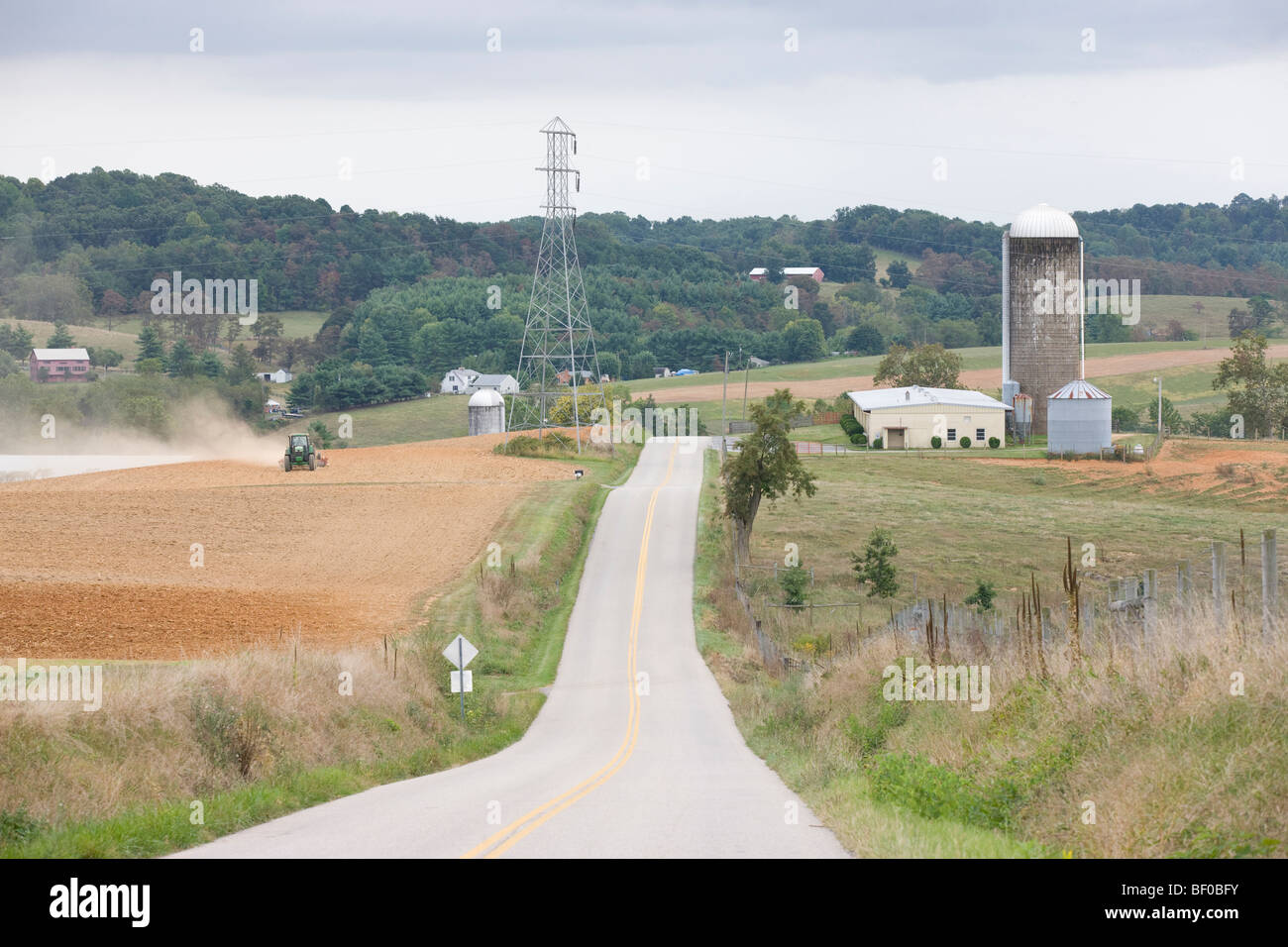 A farmer uses his tractor to work the field in Staunton, Virginia. Stock Photo