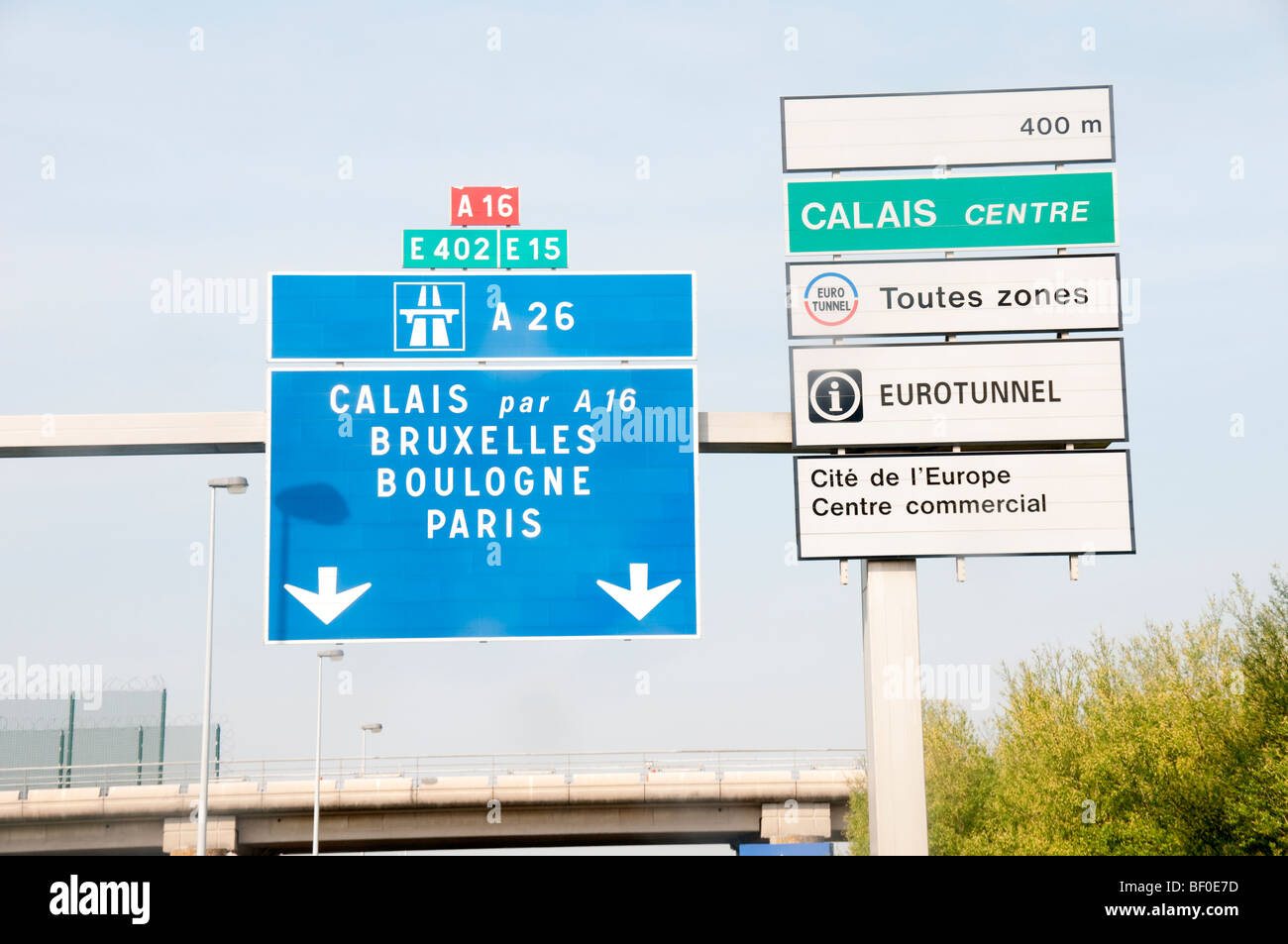 Road sign in France to Calais Bruxelles Boulogne Paris Stock Photo