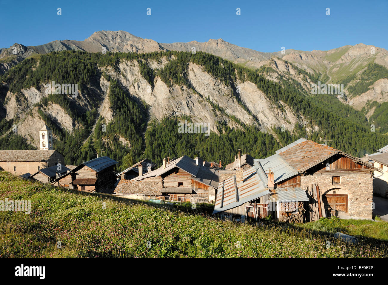 Chalets and Hillside or Mountains in the Pierre-Belle District of Saint-Véran or Saint Veran Village Queyras French Alps France Stock Photo