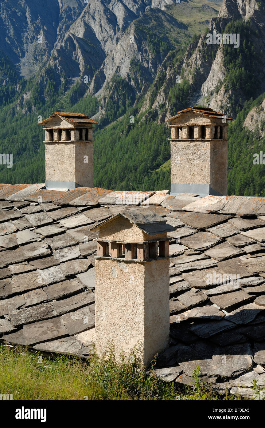 Three Chimneys & Stone Tile Roof at Saint-Véran or Saint Veran Village Quayras French Alps France Stock Photo