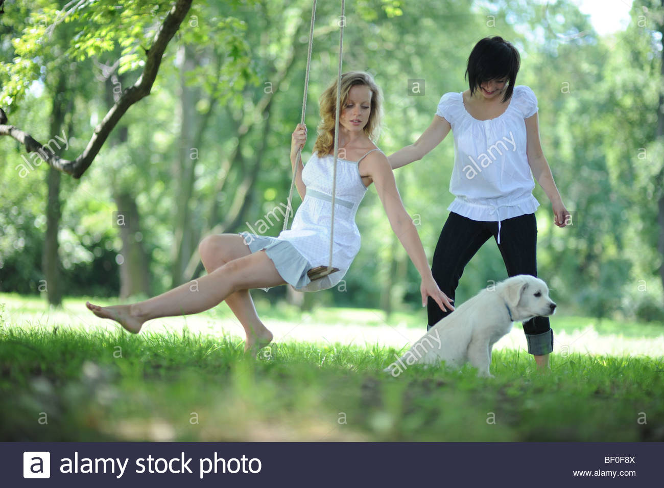 Two Young Women Swinging Stock Photo 26442218 Alamy
