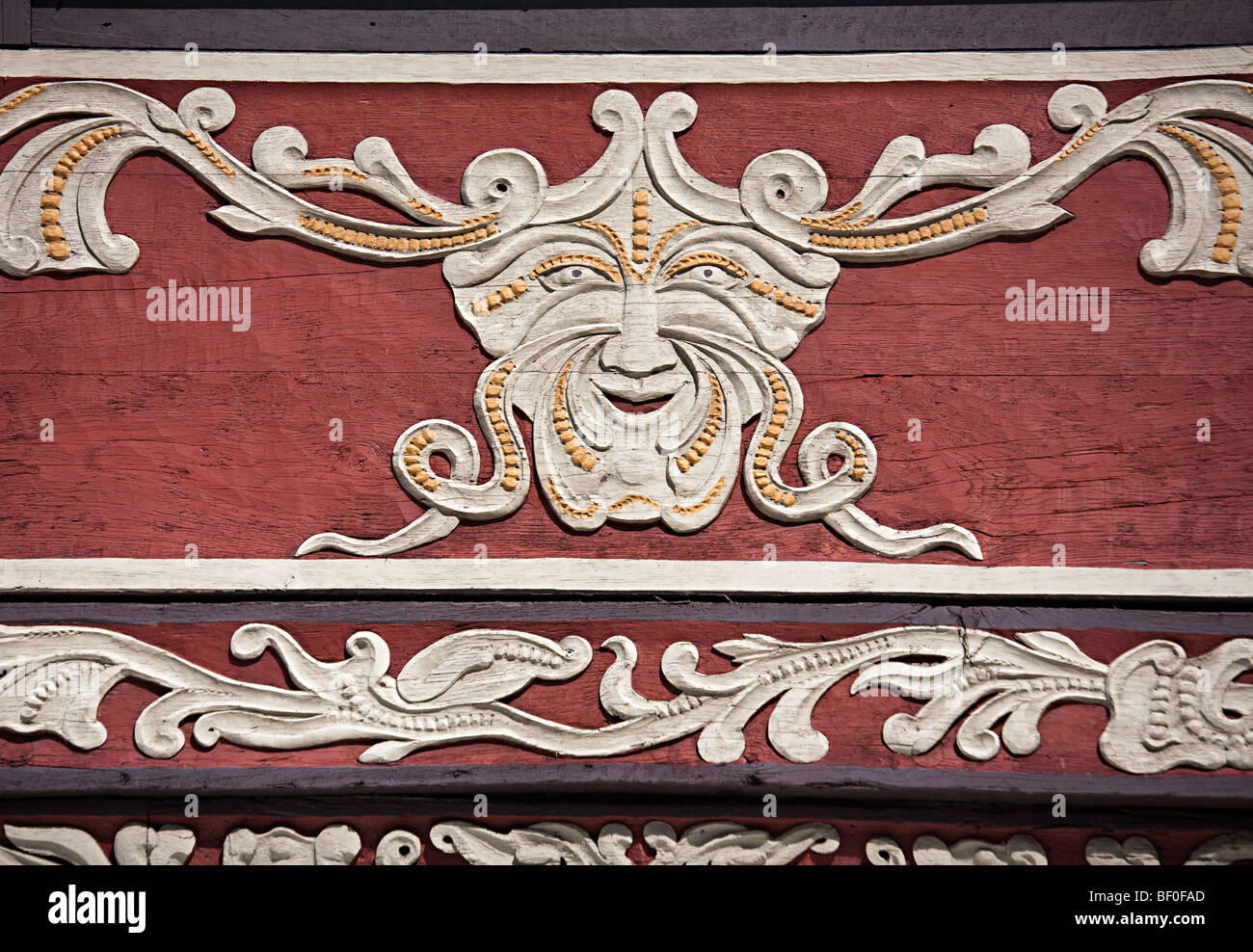 Happy face carved into wooden beam on house Hamelin Germany Stock Photo