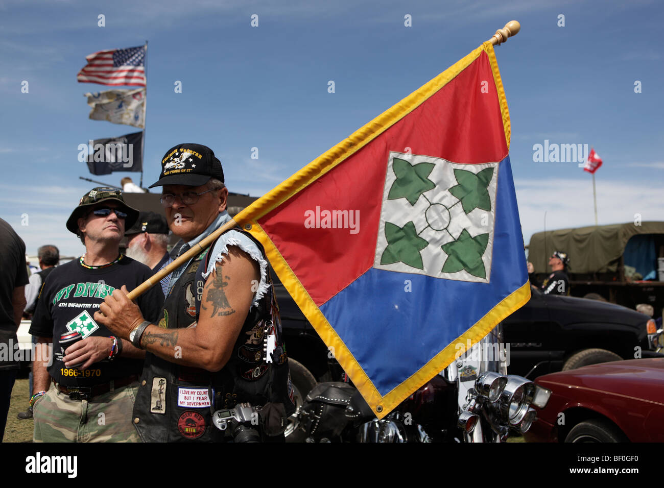 Veterans of the 4th Infantry Division hold the Ivy flag before a group photos during the Vietnam Veterans gathering in Kokomo. Stock Photo