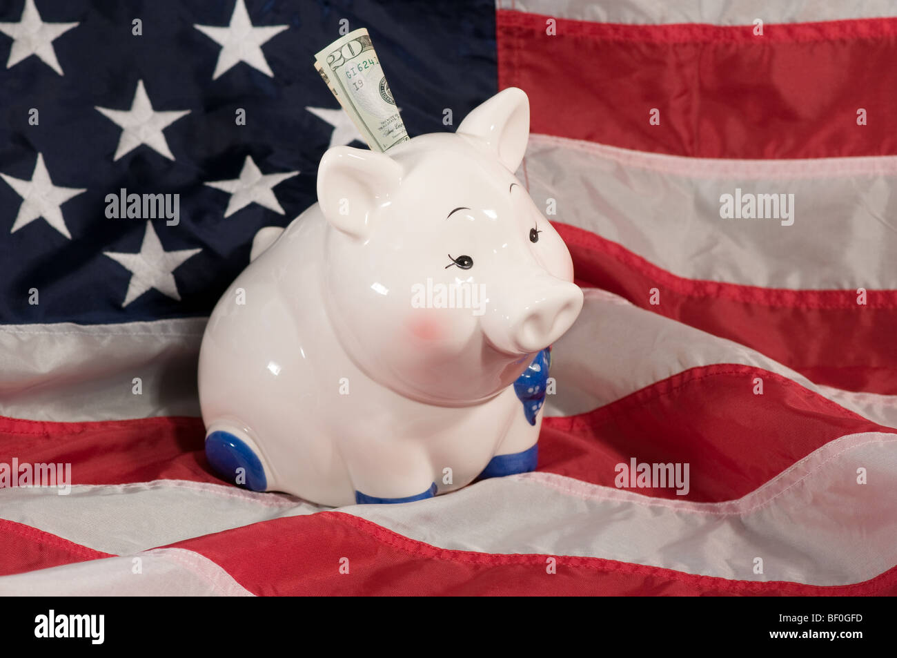 horizontal image of piggy bank on an american flag Stock Photo