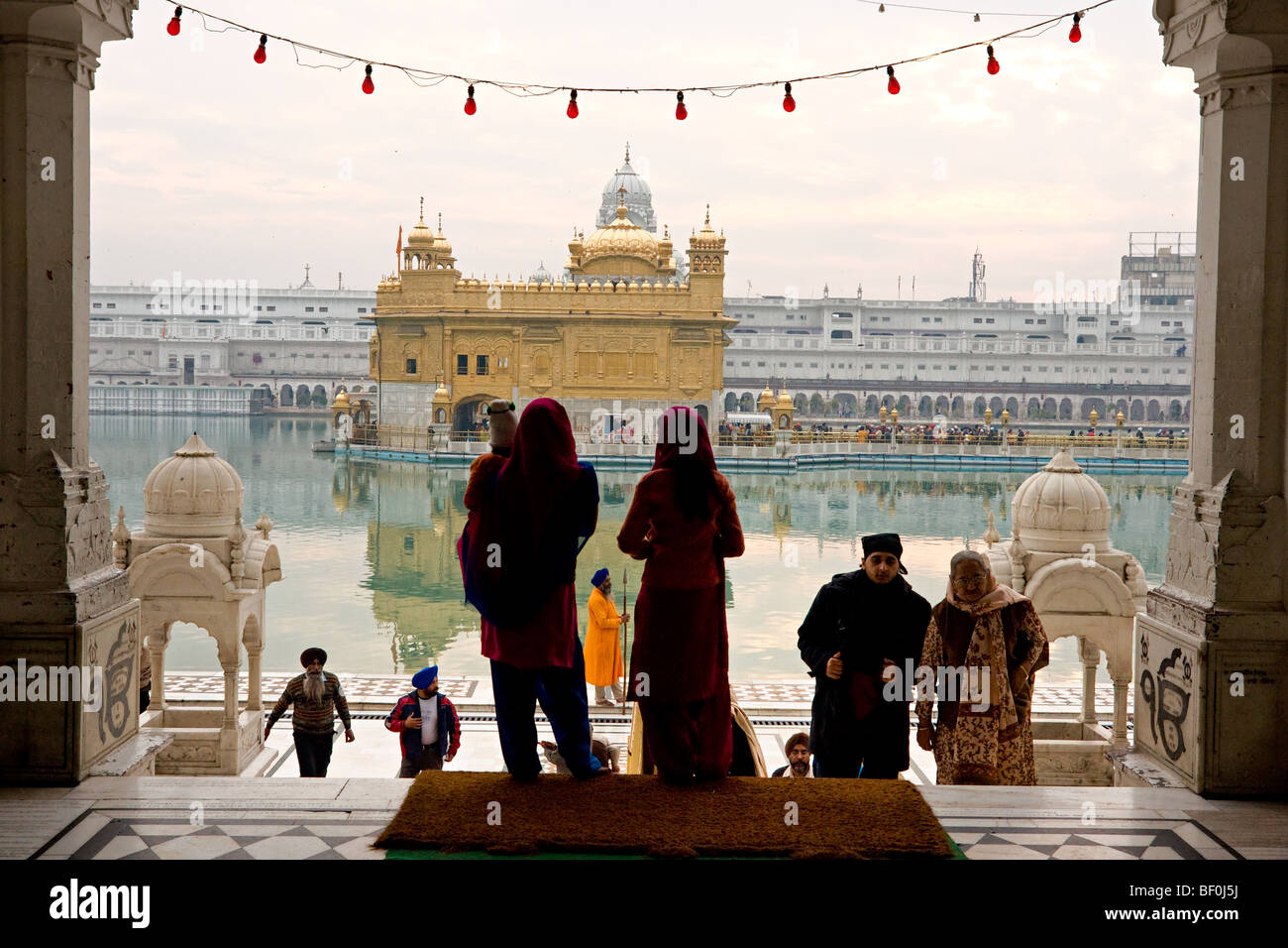 People visiting and praying at Golden Temple, Amritsar, Punjab. Stock Photo