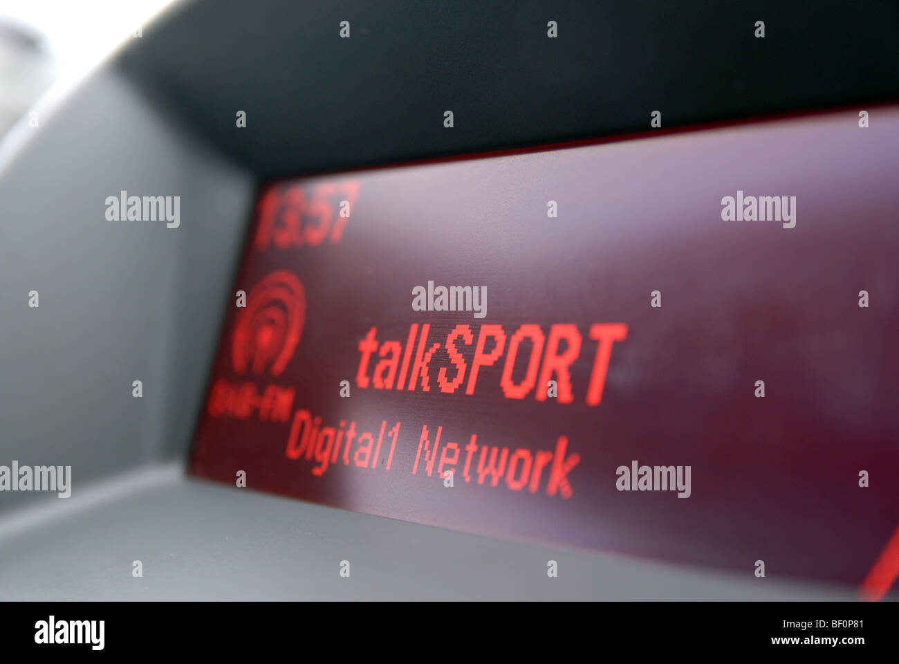 A car radio display showing talkSPORT radio Stock Photo Alamy