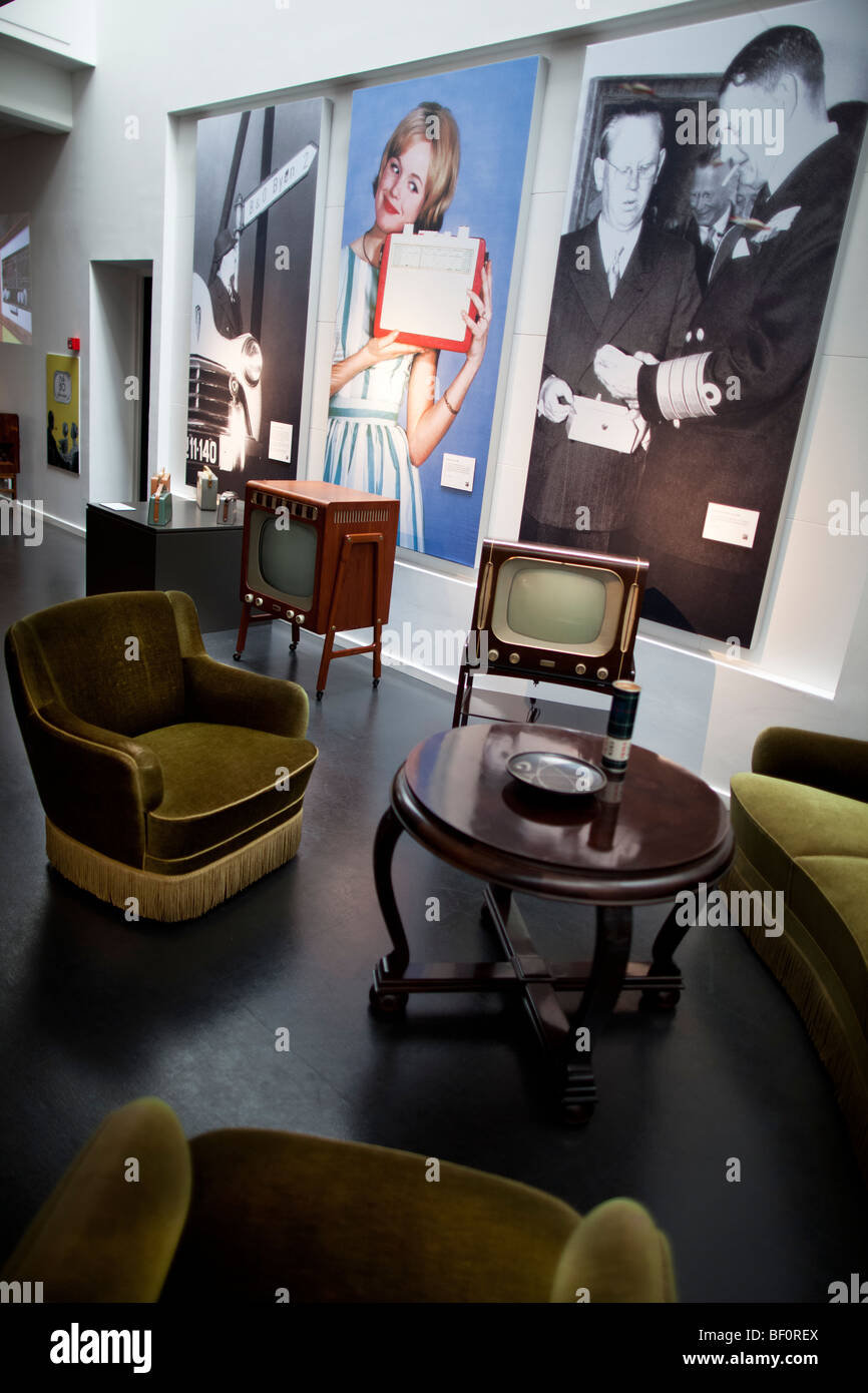 Historical televisions are seen in a recreated room furnishings in the