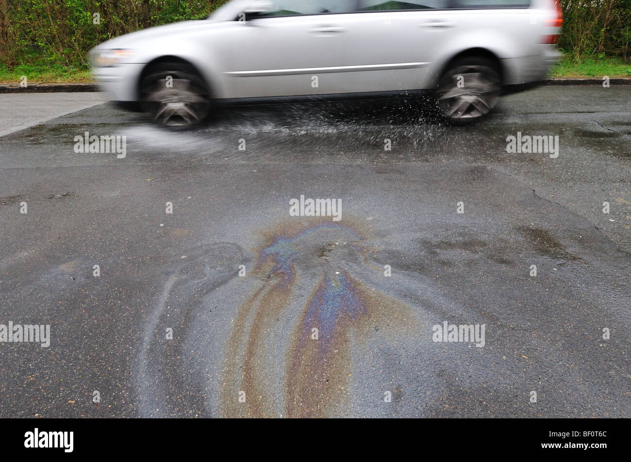 Oil slick on the road Stock Photo