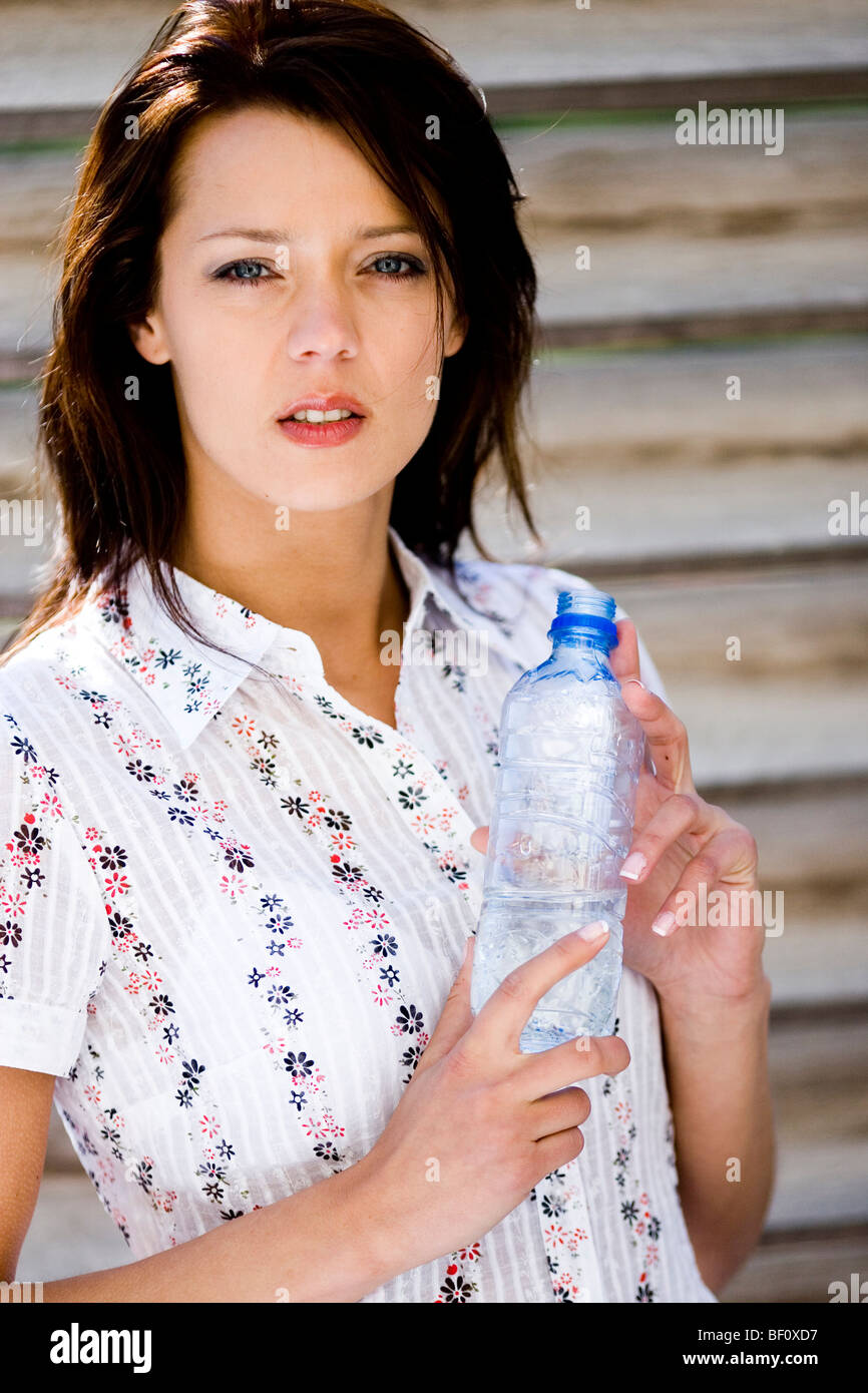 Young Woman Holding Bottle Stock Photo Alamy