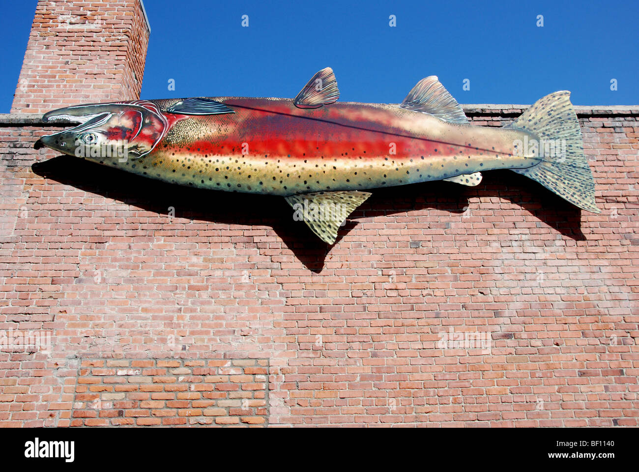 USA, Idaho, Boise, Big Salmon on Reef Restaurant Alley Wall Stock Photo
