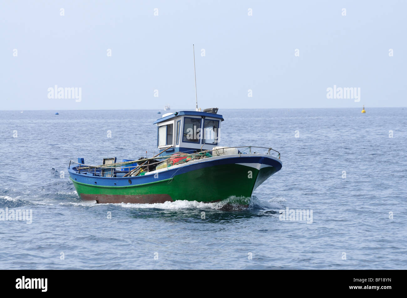 Fishing boat in the sea Stock Photo