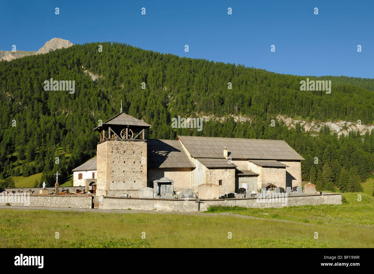 Stone Church of Saint Romain (1628-37) & Square Belfry Molines-en-Queyras Queyras Hautes-Alpes French Alps France Stock Photo