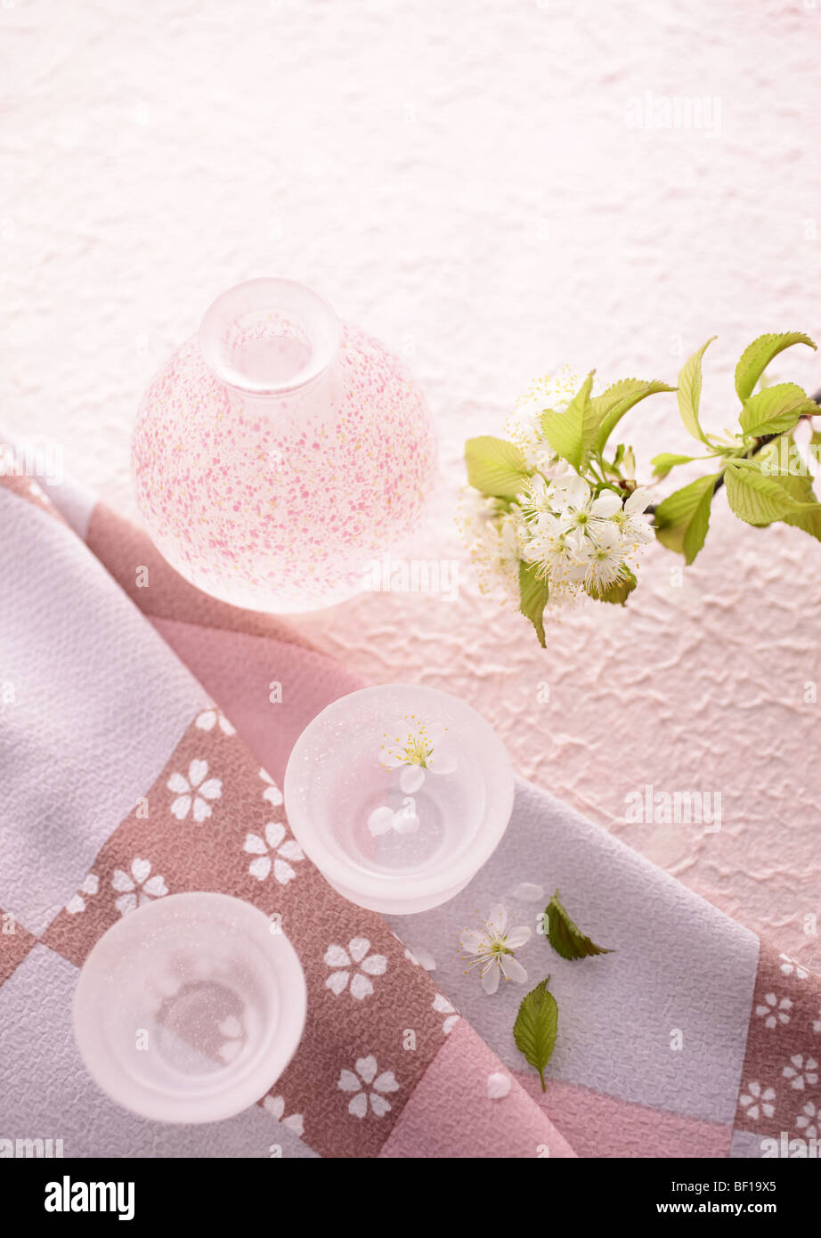 Sake and cherry blossom Stock Photo Alamy