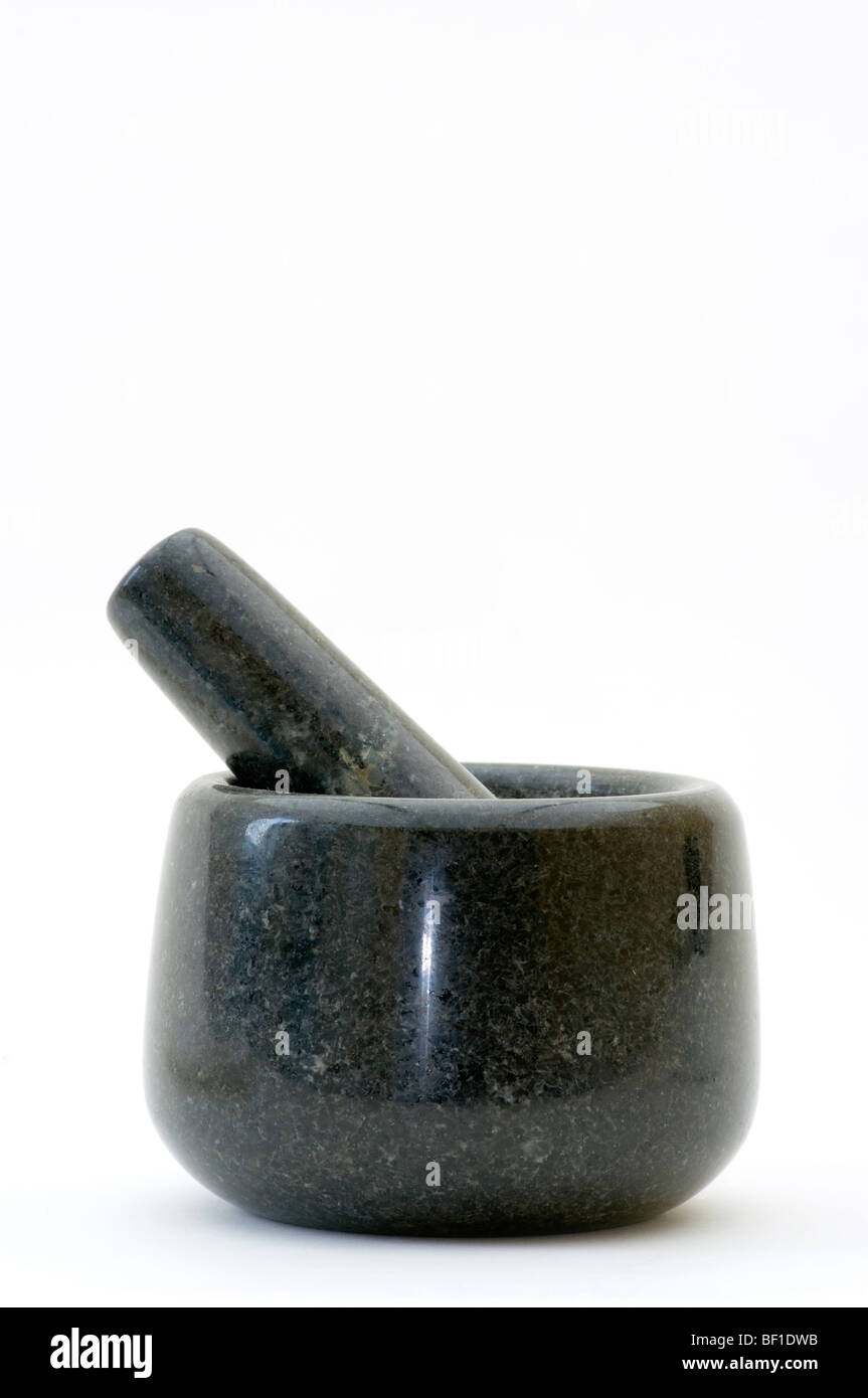 Mortar And Pestle Against A White Background Stock Photo
