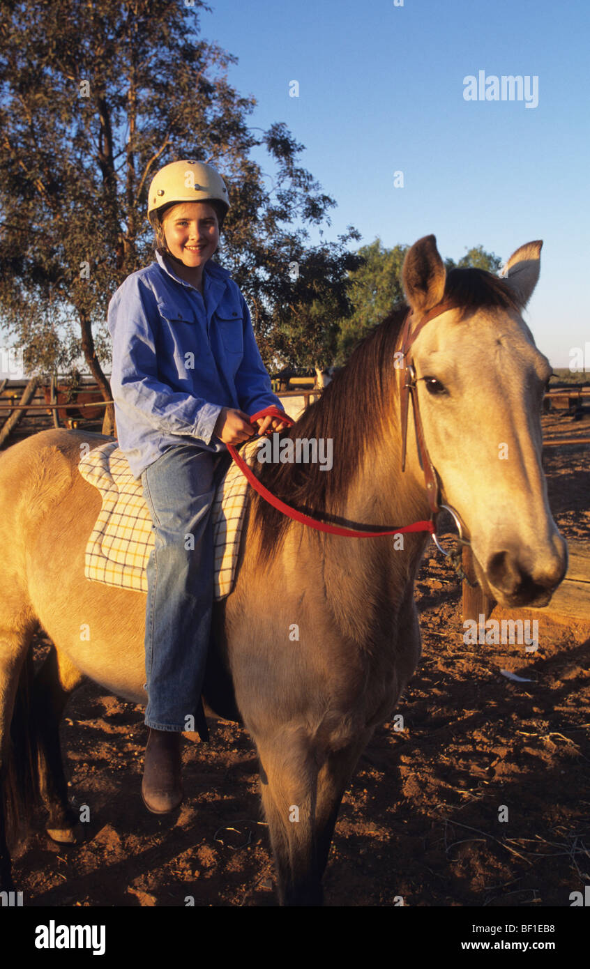 Young teenage girl riding horse, outback desert, Queensland Australia ...