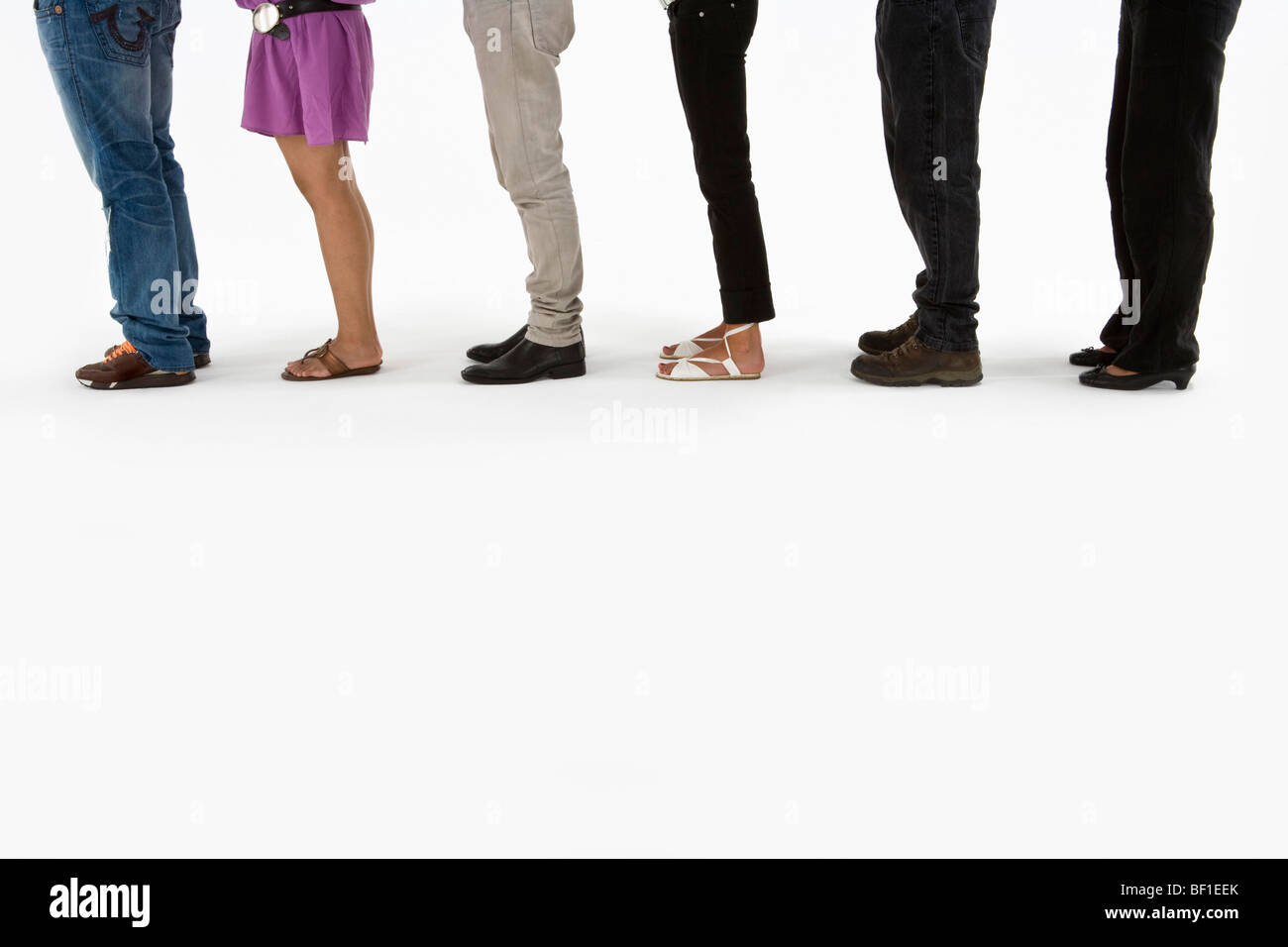 Low section of young adults standing in a line Stock Photo Alamy