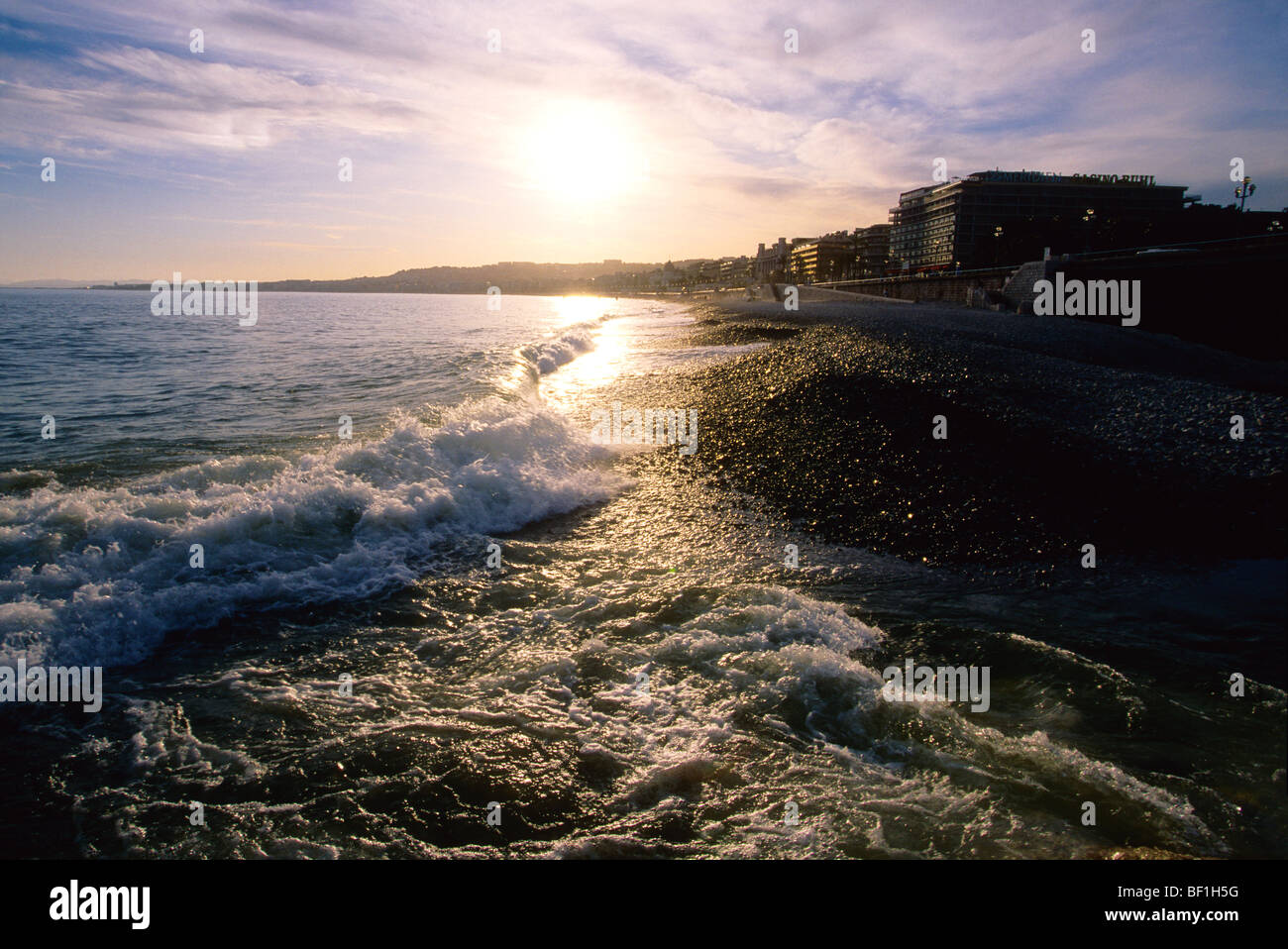 Sunset on the beach of Nice city Stock Photo