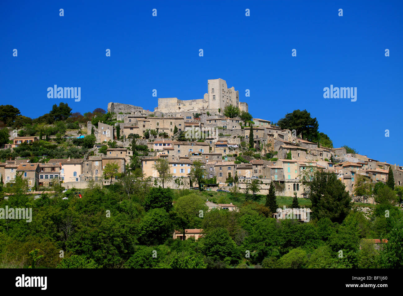 The village of Lacoste and the Chateau du Marquis de Sade owned by Mr ...