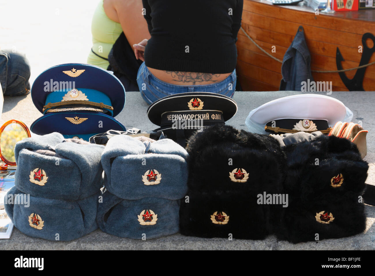 Soviet Russia Communist emblem hammer and sickle logo fur hats army hats on sale, on the street. Odessa, Ukraine  October, 2009 Stock Photo
