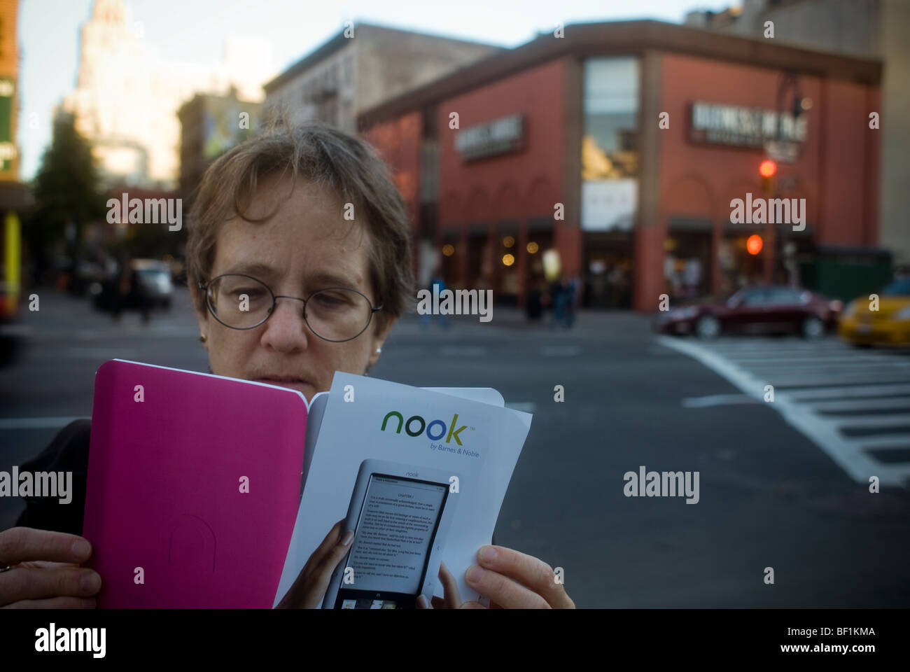A shopper looks at a brochure for the new Barnes & Noble Nook ebook ...