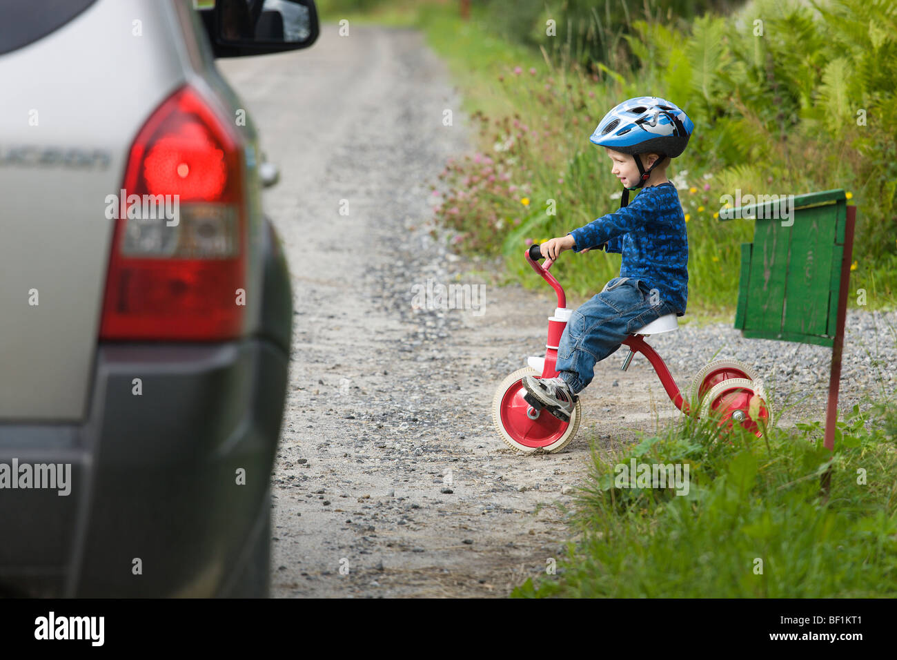 Child on tricycle hires stock photography and images Alamy