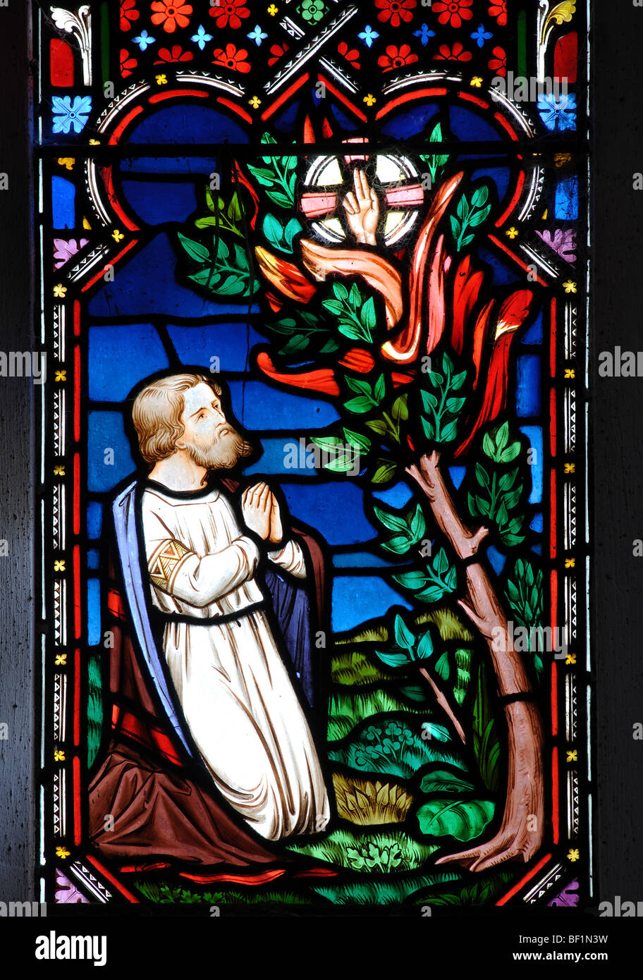 Moses and the Burning Bush stained glass, All Saints Church, Down Ampney,  Gloucestershire, England, UK Stock Photo - Alamy