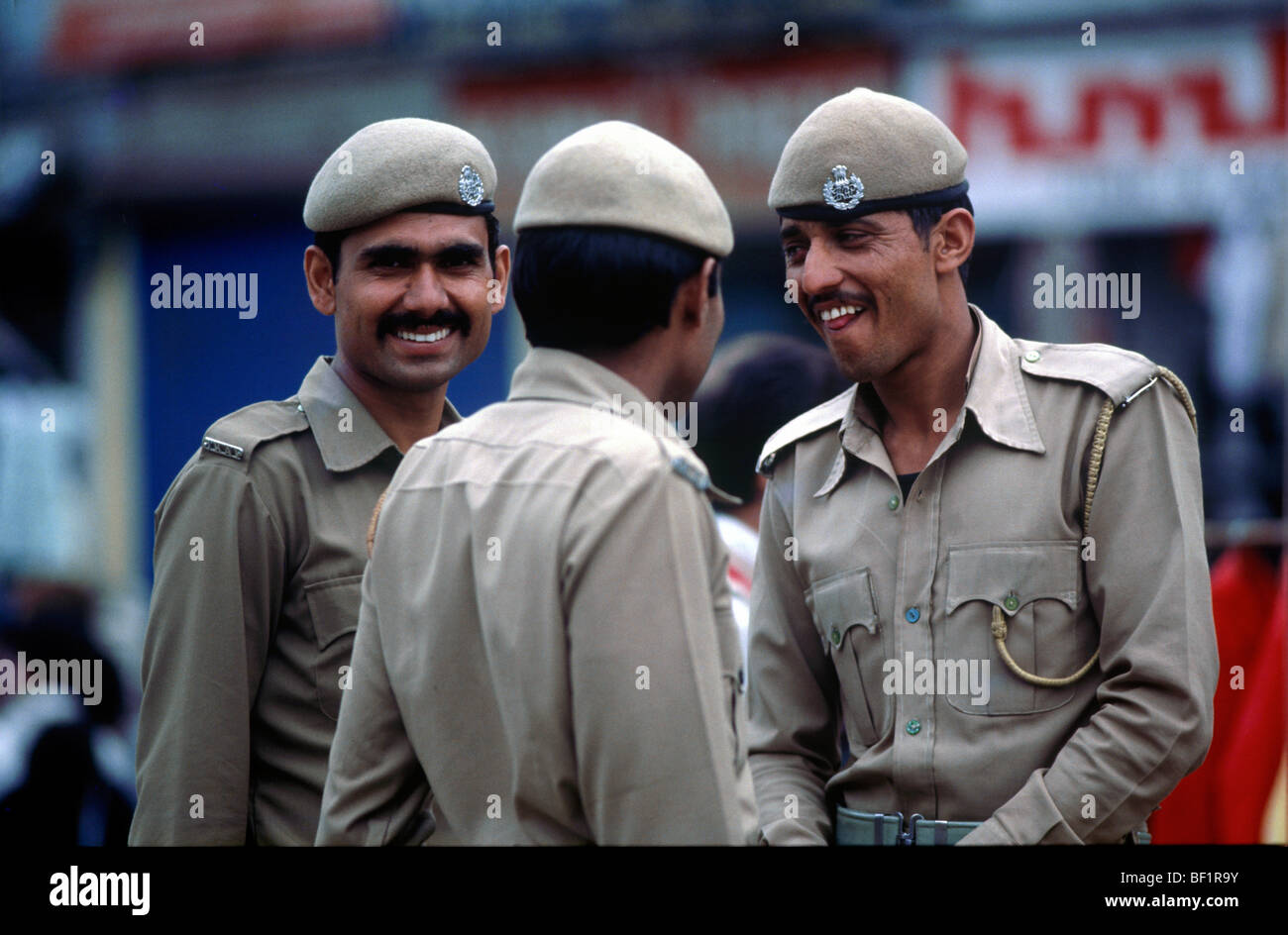 Indian policemen sharing a joke Stock Photo