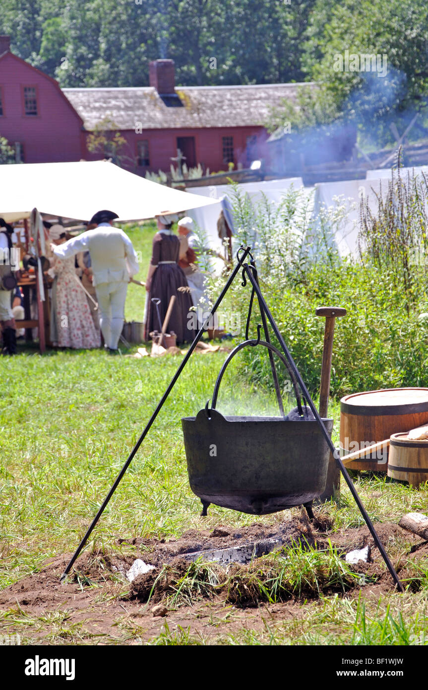 Open-fire cooking in military tent camp - costumed American Revolutionary War (1770's) era re-enactment Stock Photo