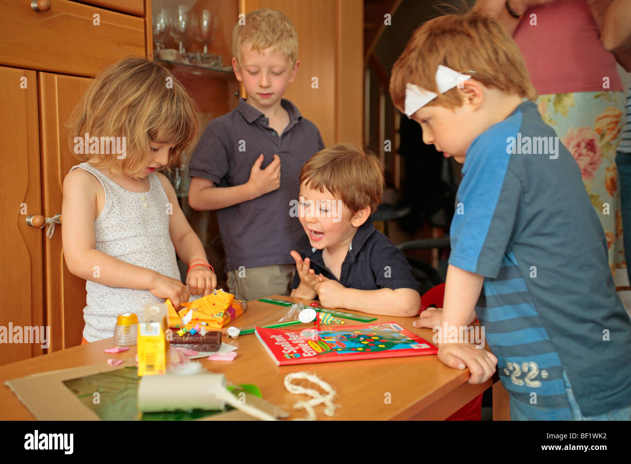 Children's birthday party, boy, girl, paper hats, whisper, cakes