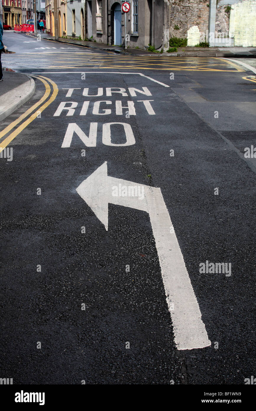 Road markings on a street in Galway indicating direction of traffic Ireland Stock Photo