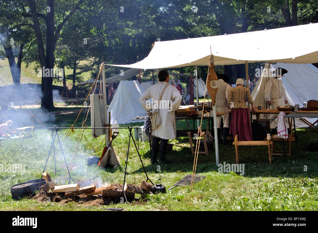 Open fire cooking in military camp - costumed American Revolutionary War (1770's) era re-enactment Stock Photo