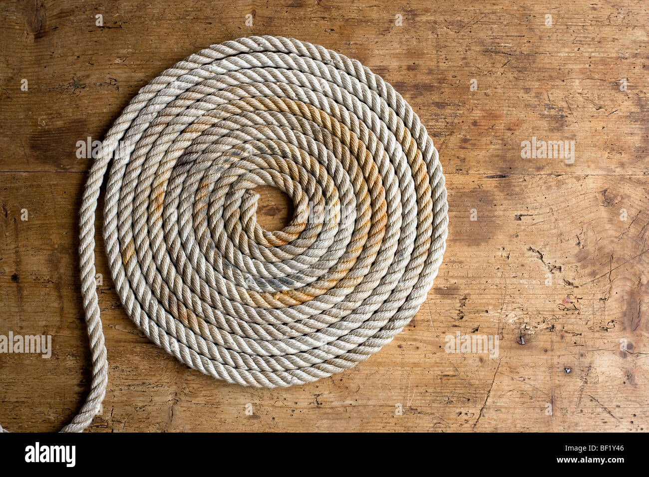 Rope coil on an antique seaman's chest Stock Photo