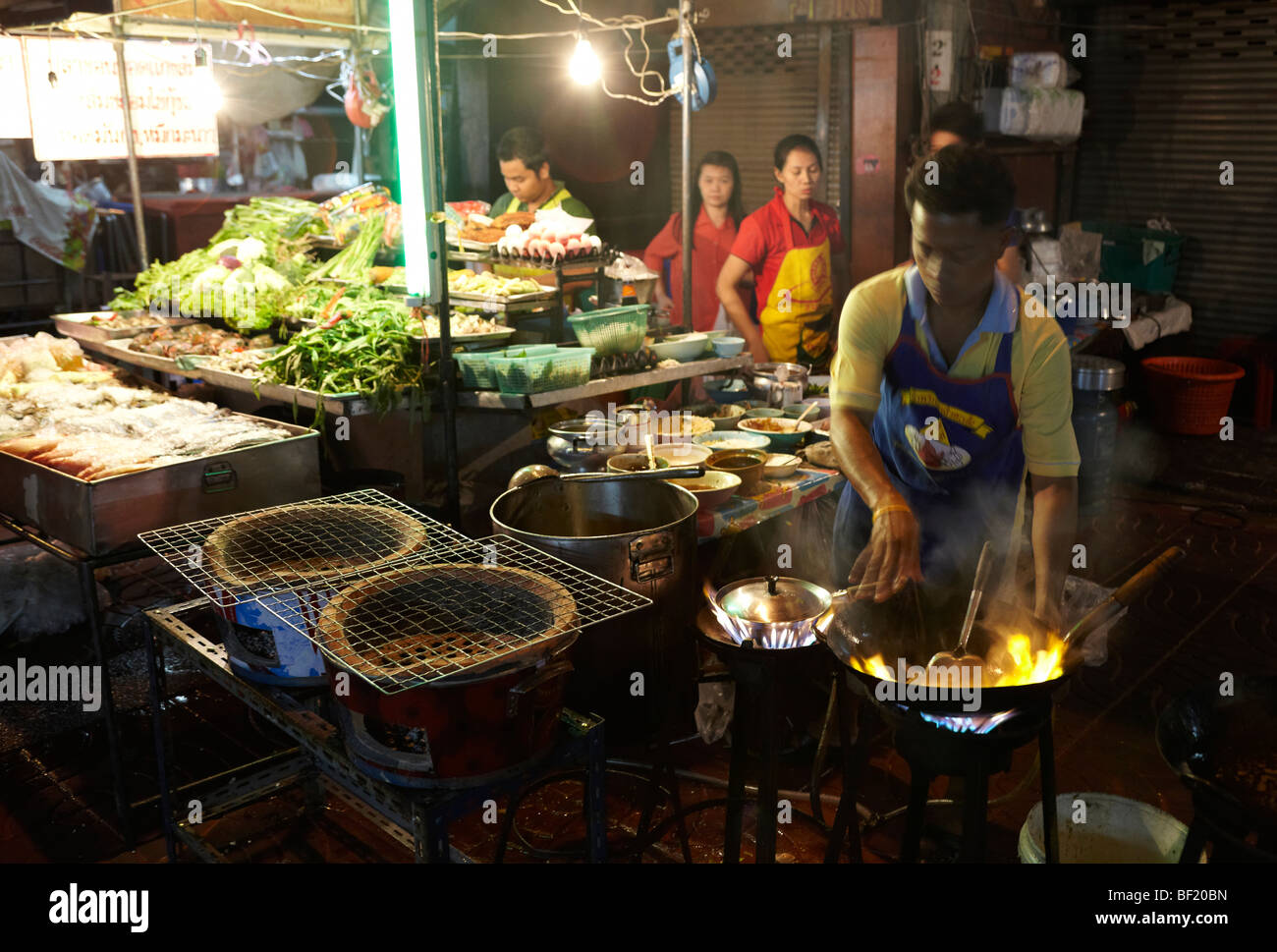 Market stall and street food being prepared in Chinatown Bangkok, Thailand. Stock Photo