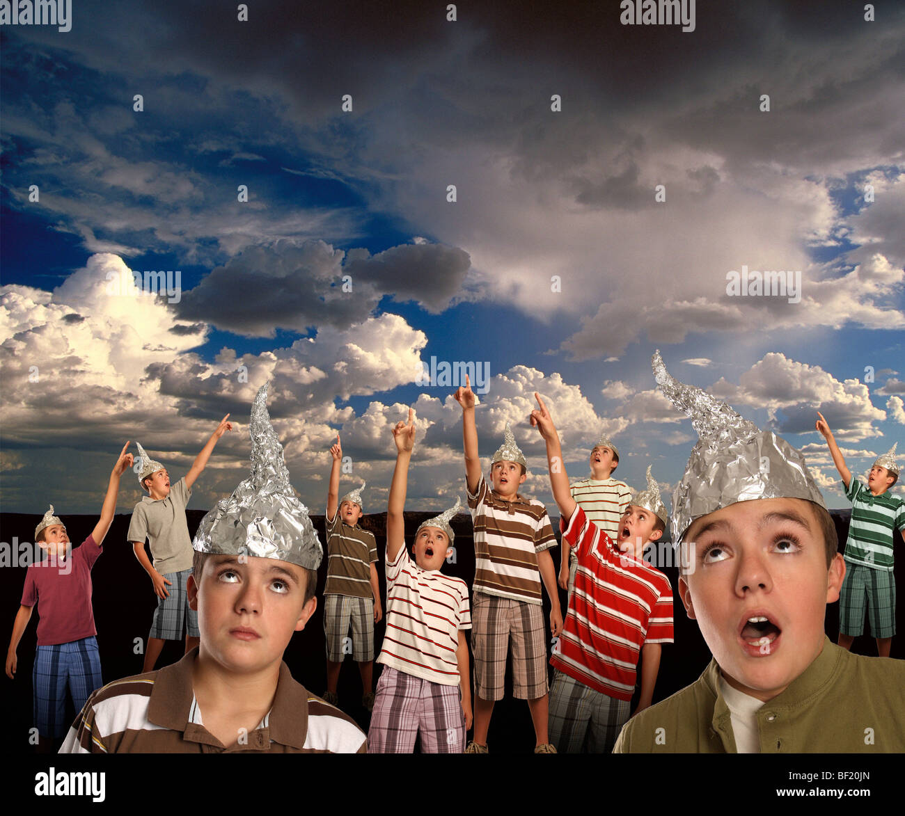 A group of CLONES wearing tin-foil hats points to the sky! Stock Photo