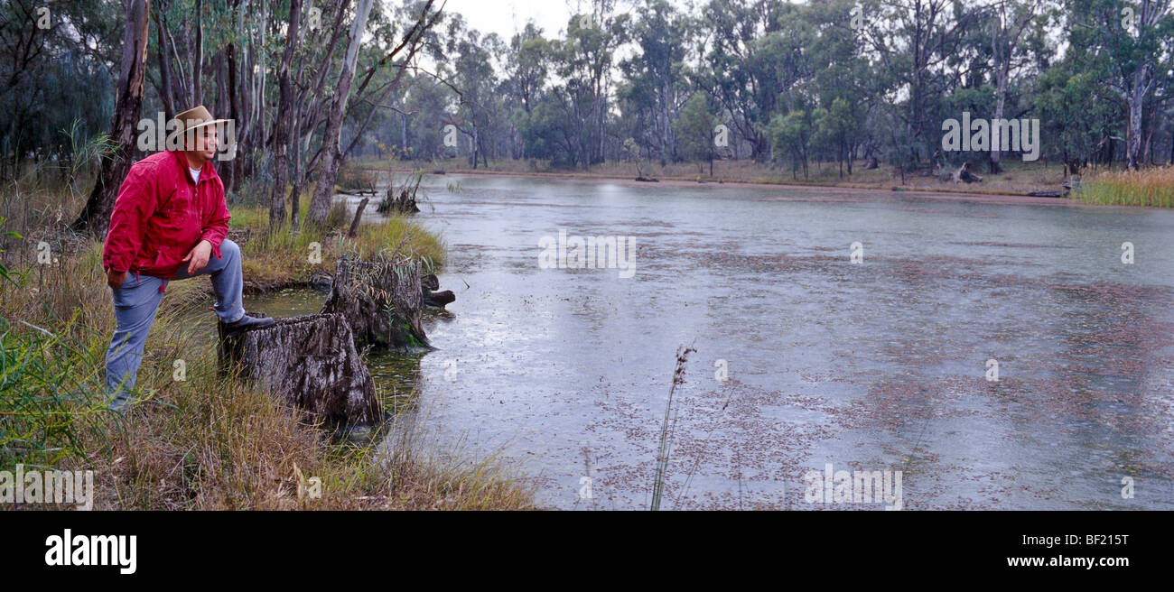 Man at billabong, Australia Stock Photo - Alamy