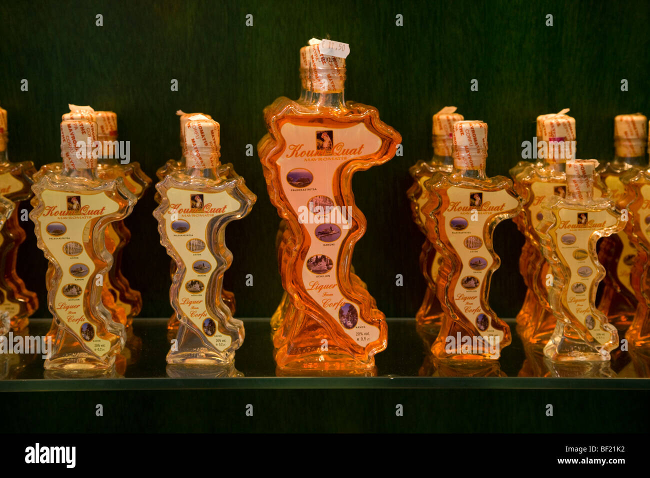 Kumquat liqueur bottles in the shape of Corfu Island, Kerkyra, Greece Stock Photo