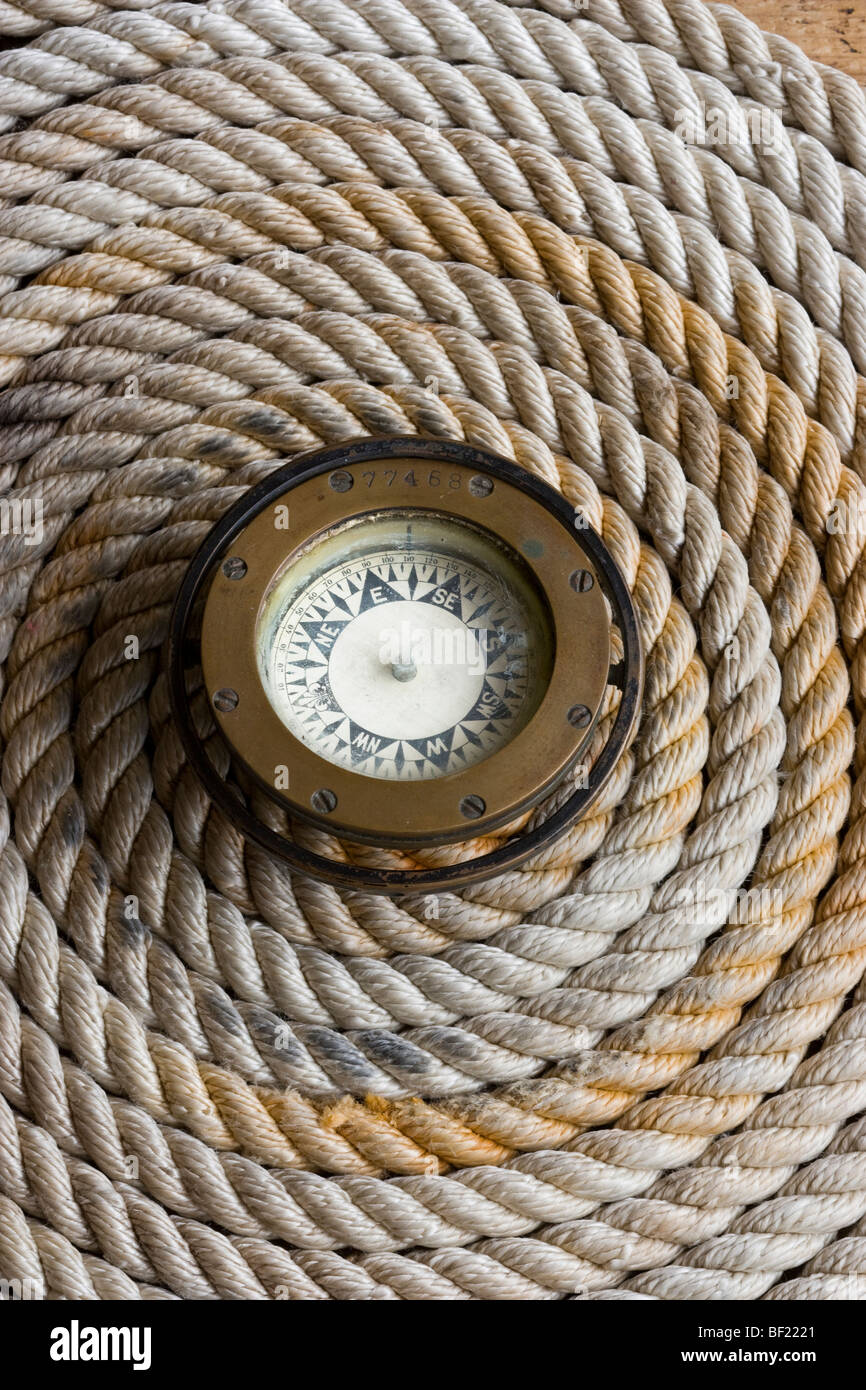 Rope coil with antique compass in the center Stock Photo