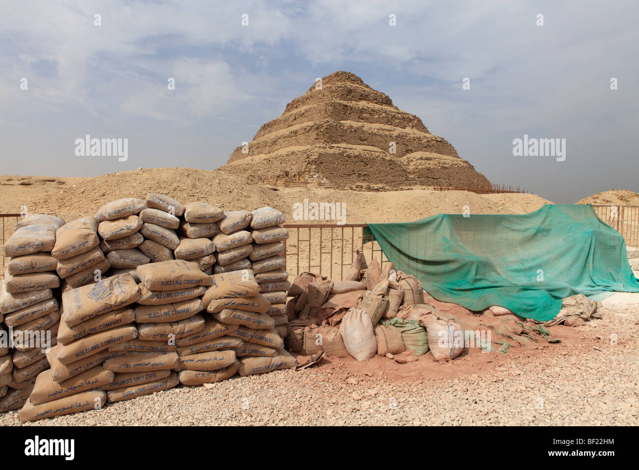 The stepped pyramid of Zoser with sacks of construction material used in restoration - Saqqara, Egypt. Stock Photo
