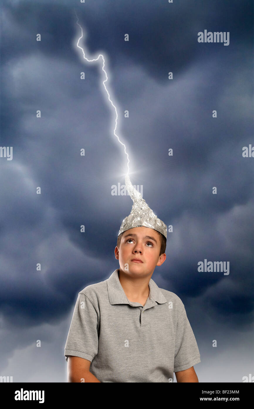 Boy wearing tin-foil hat struck by lightning. Stock Photo