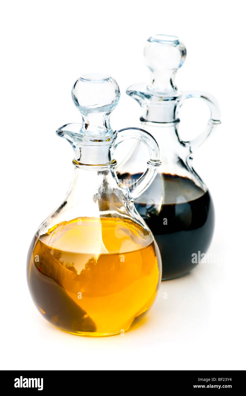 Oil and balsamic vinegar glass bottles isolated on white Stock Photo